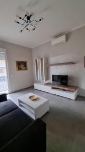 a living room with a couch and a tv at Casa Silvan in Sesto Fiorentino