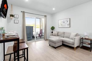 a living room with a couch and a table at The Container Retreat - 1A.. in Canyon Lake