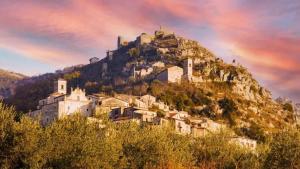 a village on a mountain with a rainbow in the sky at Zi Maria in Roccasecca