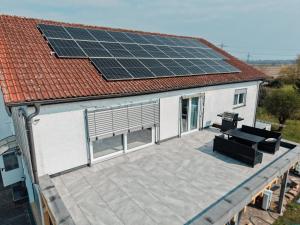a roof with solar panels on top of a house at Luxury Apartments Marz in Schwanau