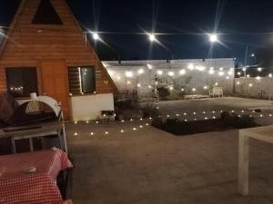 a patio at night with lights on a building at Cabaña Alpina Saltillo in Saltillo +11 photos