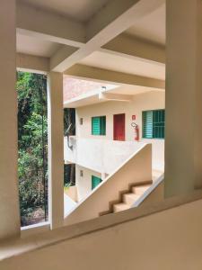 a view from a window of a house with stairs at Pousada Esperança - Areias SP in Areias