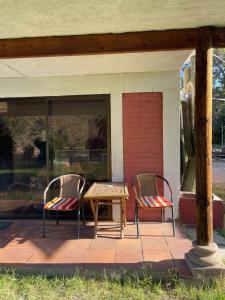 two chairs and a table on a porch at Casa Ordóñez - Cielo Abierto in El Molino +5 photos