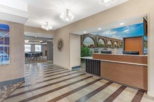 a lobby with a bridge painting on the wall at Best Western Plus Glen Allen Inn in Richmond +50 photos