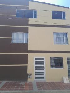 a building with windows on the side of it at Alojamiento y Confort in Tunja