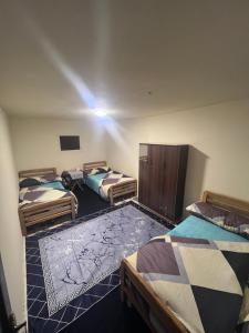 a room with three beds in a room at قمه التجلي in Saint Catherine