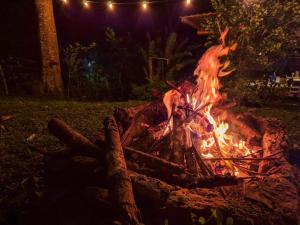 a fire pit in the yard at night at Cabaña Campestre de Descanso in Melgar +14 photos