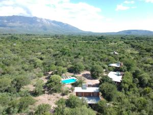 an aerial view of a house in the middle of a forest at Cabañas Llajta Sumaj in Las Calles