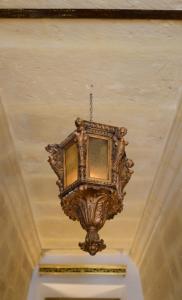 a chandelier hanging from a ceiling in a room at Paulos Valletta in Valletta