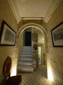 a stairway leading up to a room with a staircase leading up to a at Paulos Valletta in Valletta