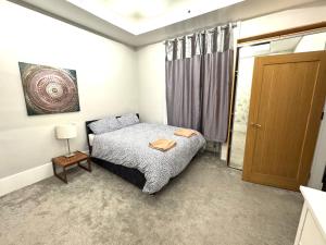 a bedroom with a bed and a sliding glass door at Meze hotel in Perth