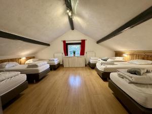 a room with a bunch of beds in it at Annexe in Sourbrodt +31 photos