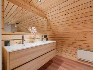 a bathroom with a white sink and wooden walls at ZweveZalig in Zwevezele +38 photos