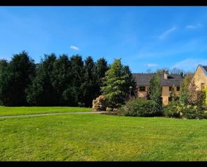 a house in a field of green grass at Shamrock House in Fintona