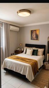 a bedroom with a large bed in a room at Moriah Hostel e Pousada in Praia Grande