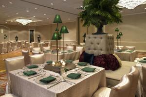 a dining room with white tables and chairs at The Whitehall Houston in Houston +111 photos