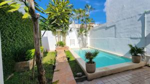 a swimming pool in the backyard of a house at Beautiful house with a pool in Mérida