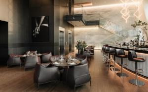 a restaurant with tables and chairs and a bar at Alexander, Member of The Leading Hotels of the World in Mexico City