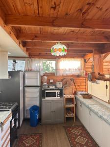a kitchen with a stove and a refrigerator at Casa Almar in Algarrobo +16 photos