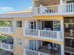 an aerial view of a building with balconies at Blue Bay Apartments in Dorp Sint Michiel