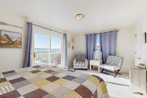 a bedroom with a bed and a chair and a window at Bear Lake View in Garden City +25 photos