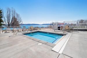 a swimming pool with a view of the water at Bear Lake View in Garden City