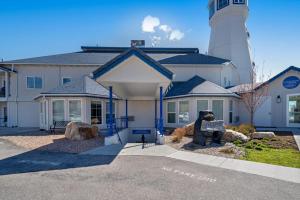 a house with a lighthouse in front of it at Bear Lake View in Garden City