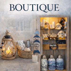 a book about a boutique with a shelf with baskets at Auberge Beausejour in Les Éboulements +49 photos