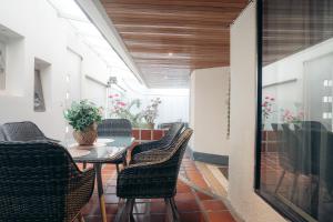 a dining room with a table and chairs at Tefos room in Quito