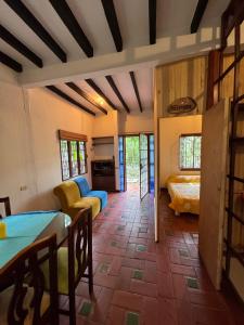 a living room with a couch and a table at Hospedaje Casa Renasiente Cali in Cali
