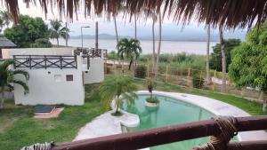 a swimming pool with a view of the ocean at Laguinn Hotel Acapulco in Acapulco