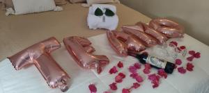 a cake that says love on top of a table at Vila Pescador Fortim in Fortim