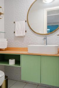 a bathroom with a sink and a mirror at Lili’s room in Quito +33 photos