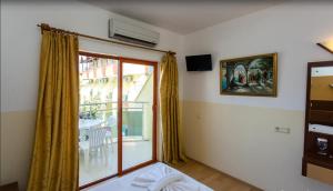 Postel nebo postele na pokoji v ubytování Wassermann Hotel