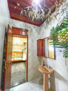 a bathroom with a sink and a mirror at Hostel Povos da Floresta in Rio Branco +32 photos