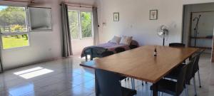 a living room with a table and a couch at El Chiringuito in Paraná