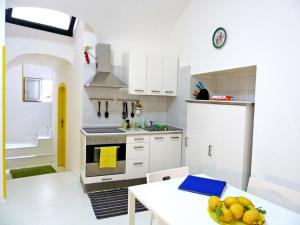 O bucătărie sau chicinetă la Sciù Sciù House