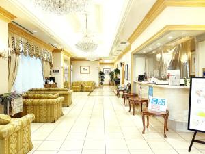 a large lobby with couches and tables in a store at Hotel Premium Green Sovereign in Sendai +26 photos