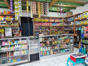 a store filled with lots of different types of food at MJR Ticketing Guest House in Ruteng