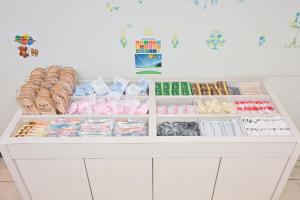 a white counter with many different types of food at La'gent Hotel Osaka Bay in Osaka