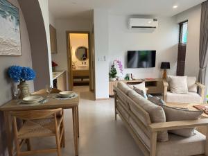 a living room with a couch and a table at Minh Anh Hotel in Phú Quốc