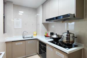 a kitchen with two pots and pans on a stove at WeChat user-s store in Gongche +11 photos
