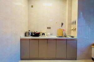 a kitchen with a sink and a counter top at Luke Cloud RSJA-s store in Gongche +6 photos