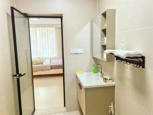 a bathroom with a shower and a sink and a mirror at Luke Cloud GSHT Store in Luoyang +27 photos
