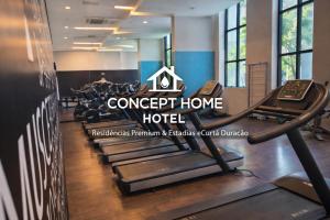 a gym with treadmills and a concept home hotel at Astron Mundial luxo Concept in Salvador