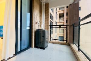 an empty balcony of a building with a large window at Luke Cloud MVHG-s store in Gongche