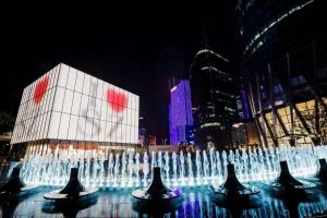 a water fountain in front of a building at night at Andaz Shenzhen Bay in Shenzhen