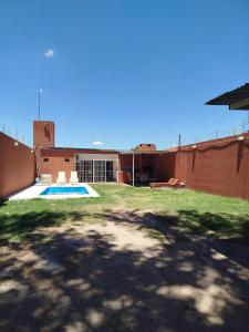 a backyard of a house with a swimming pool at mary in San Luis