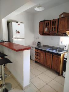 a kitchen with a sink and a refrigerator at mary in San Luis