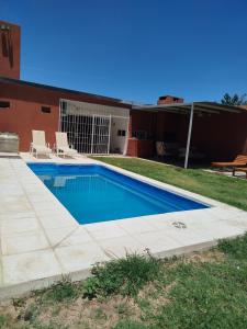a swimming pool in front of a house at mary in San Luis